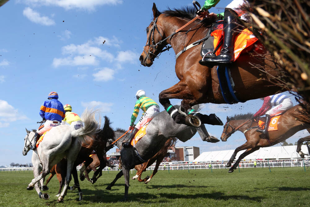 Horses and jockeys tackling fences in a National Hunt steeplechase – 2025/26 jumps season horses to follow