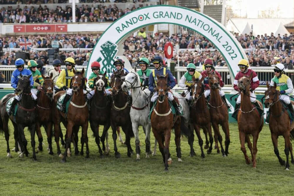 Grand National 2025 runners gather under the Randox Grand National arch at Aintree before the race start