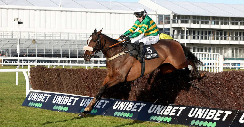 Agwar and Jonjo O’Neill Jr jumping a fence at Cheltenham Racecourse